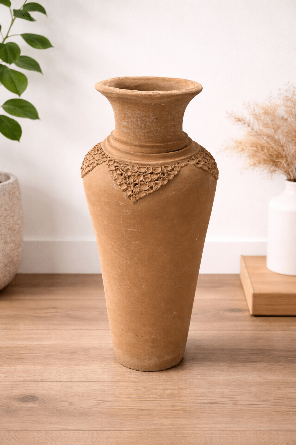 Handcrafted African pottery vase with elegant tall form, smooth finish, and warm earth tones