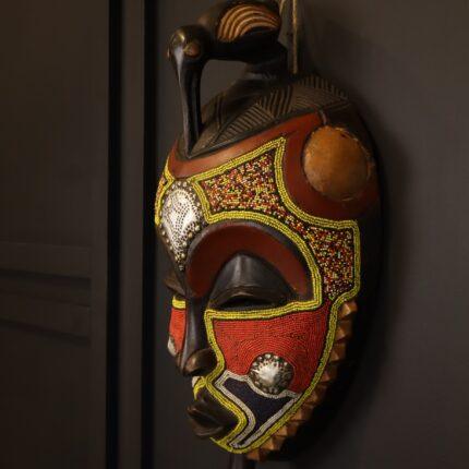 Crimson Bird Guardian Mask – African Beaded Wall Décor